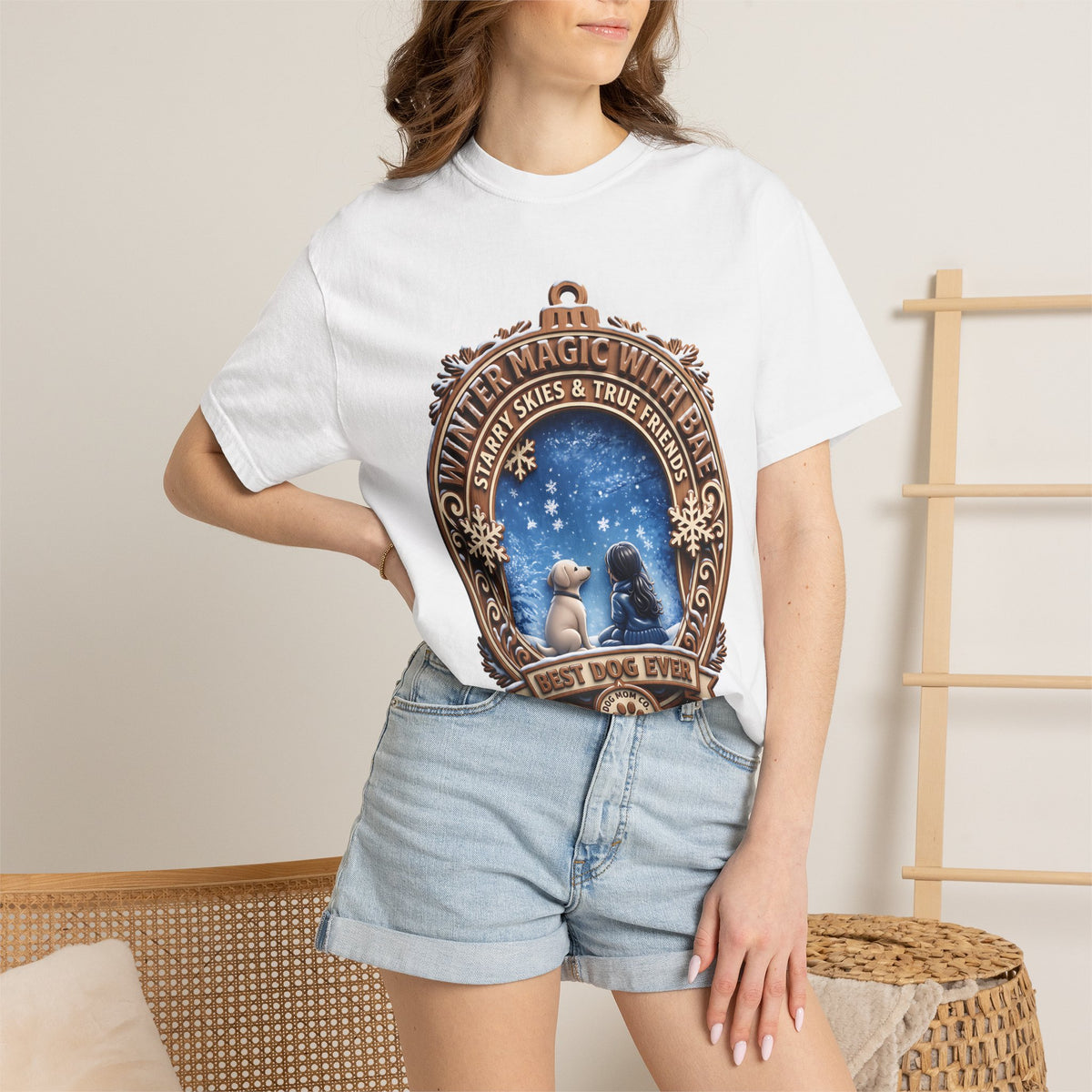 Woman wearing the white Winter Magic With Bae dog t-shirt with denim shorts